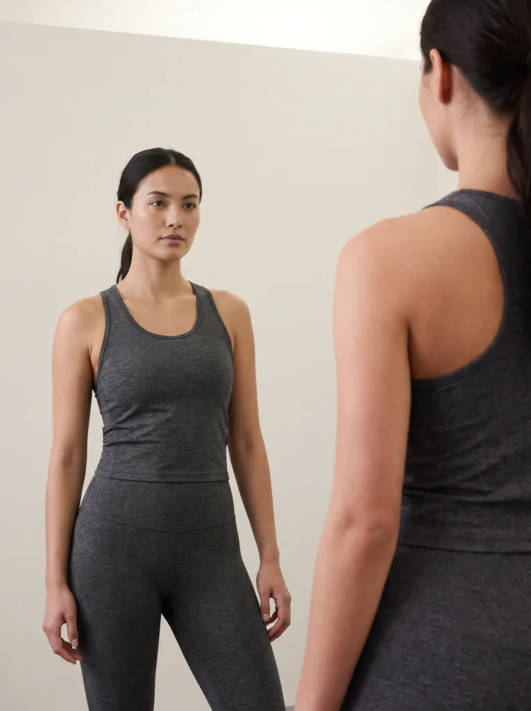 Realistic try-on of athletic activewear, even studio light, neutral background, realistic fabric and fit